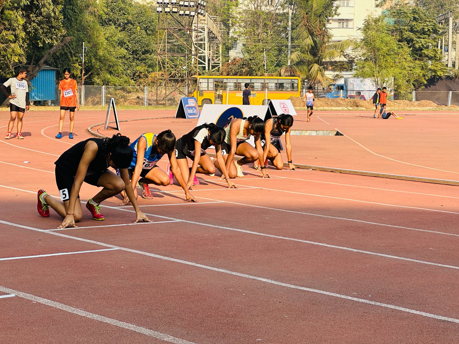 Young athletes preparing on the track